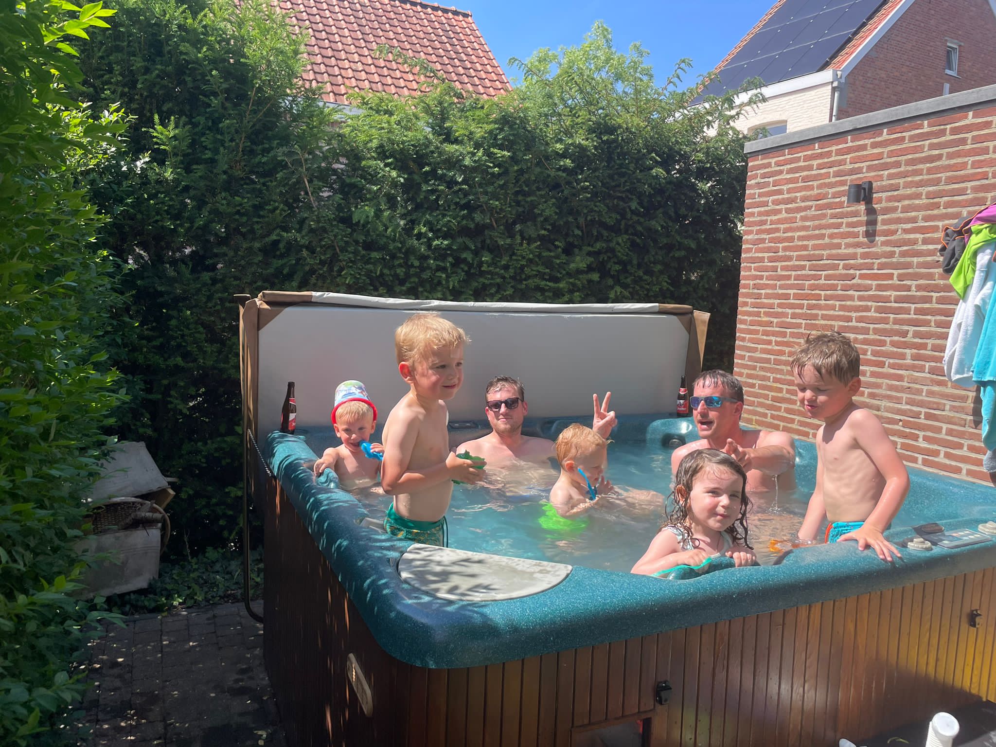 family in a beachcomber hot tub